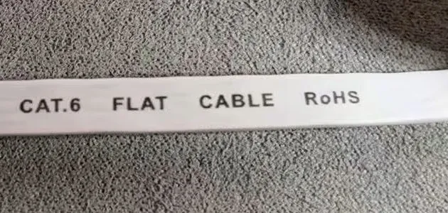 A flat Ethernet cable jacket printed only with CAT.6 FLAT CABLE RoHS.