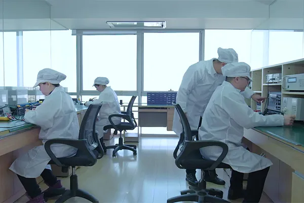 Engineers at an in-house QC and R&D test bench