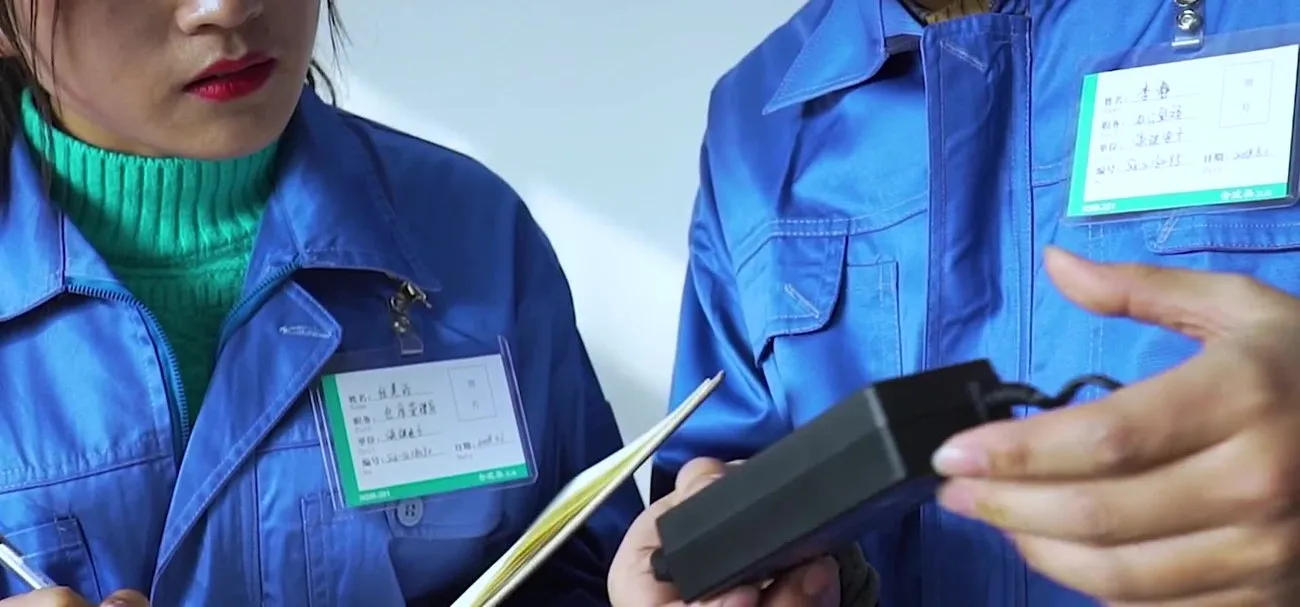 Incoming QC — inspecting a power adapter against its spec