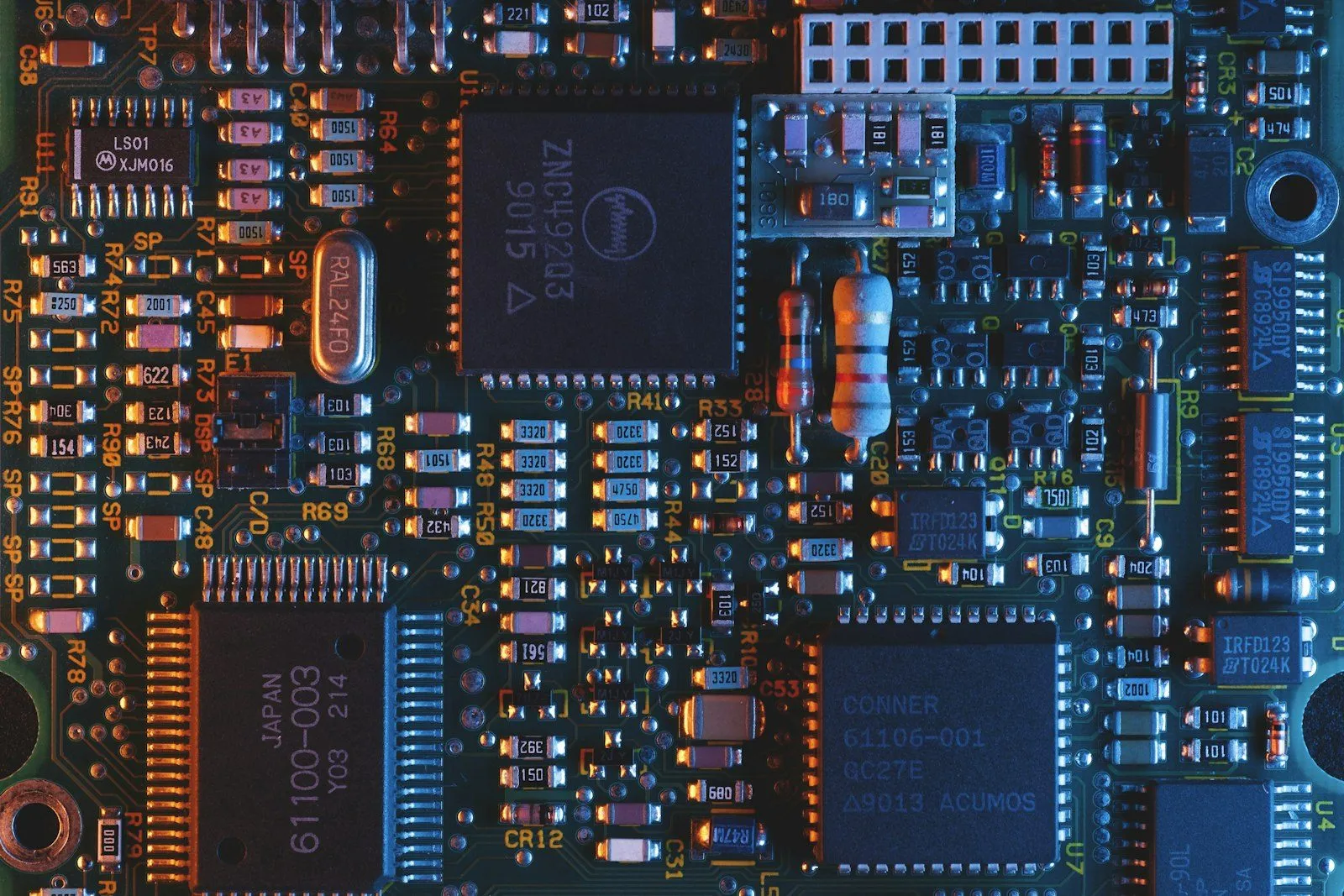 A populated printed circuit board — origin turns on where the board is built and programmed.